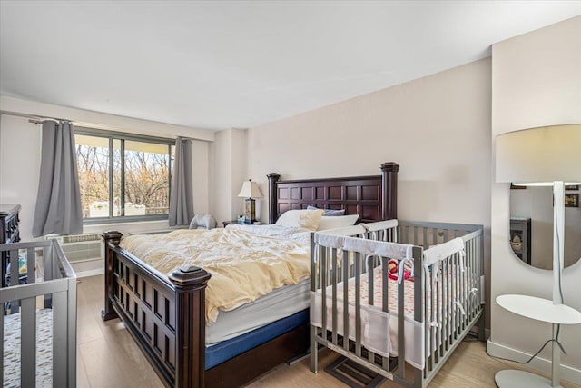 220-55 46th Ave Unit 3U, Bayside, NY 11361 - bedroom with baseboards and wood finished floors