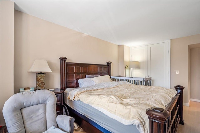 220-55 46th Ave Unit 3U, Bayside, NY 11361 - bedroom featuring wood finished floors, baseboards, and a closet