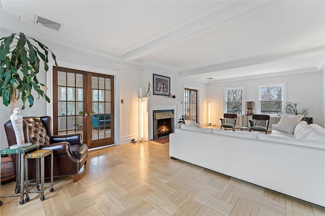 living room featuring visible vents, french doors, baseboards, beamed ceiling, and a lit fireplace