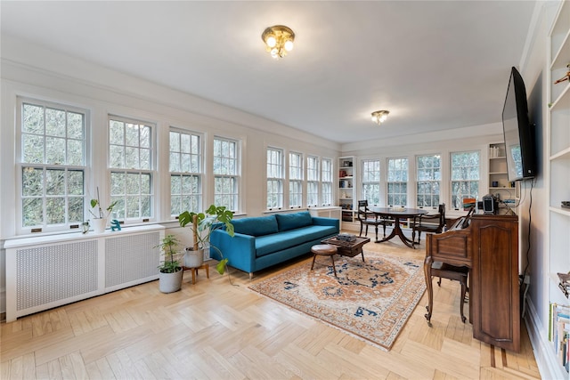sunroom / solarium featuring radiator