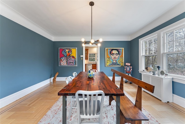 dining room featuring baseboards and a chandelier