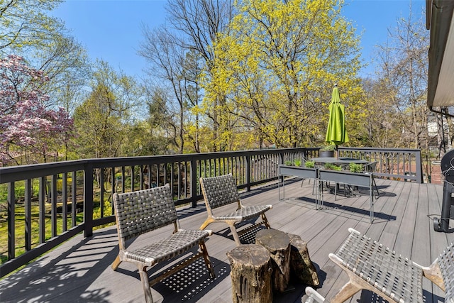 wooden deck with outdoor dining area