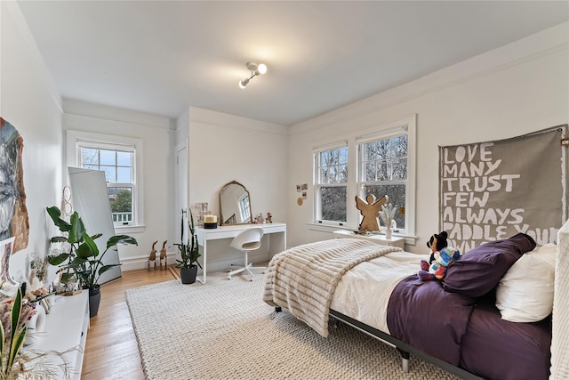 bedroom featuring light wood finished floors