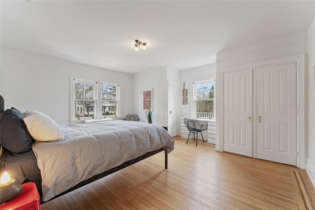 bedroom featuring light wood-style flooring