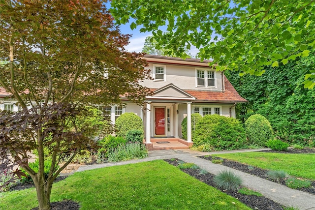 41 Euclid Ave, Hastings-On-Hudson, NY 10706 - view of front of home featuring stucco siding and a front yard