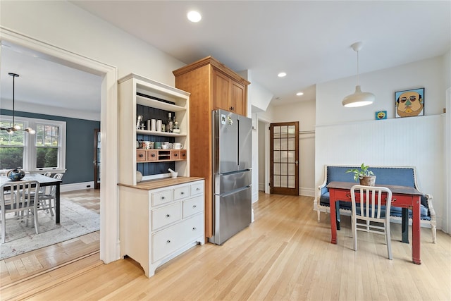 41 Euclid Ave, Hastings-On-Hudson, NY 10706 - kitchen with freestanding refrigerator, light wood-type flooring, pendant lighting, a wainscoted wall, and recessed lighting