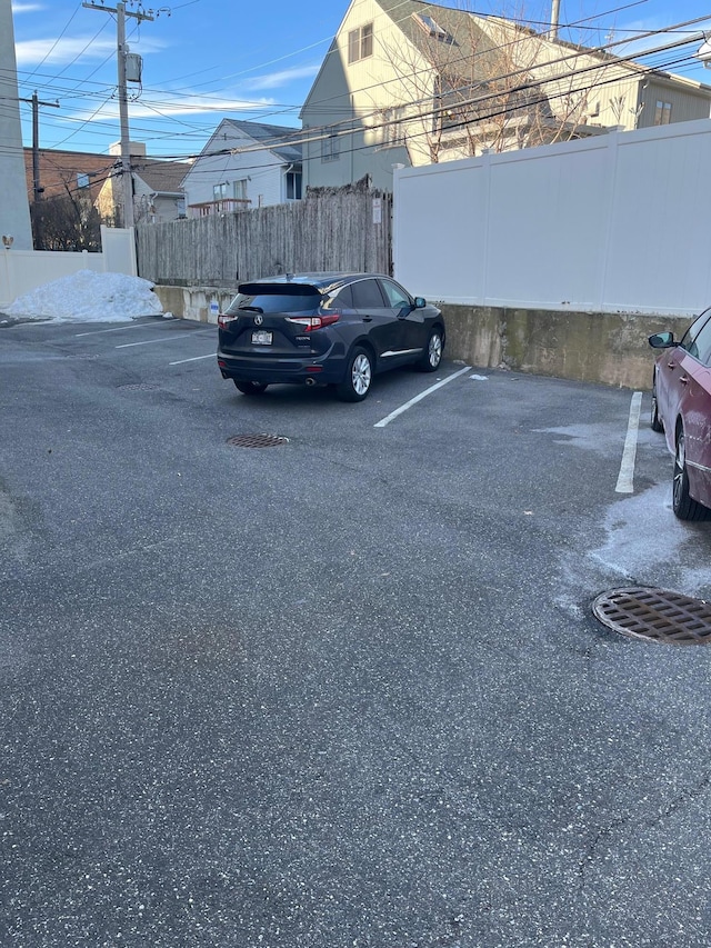 uncovered parking lot with fence