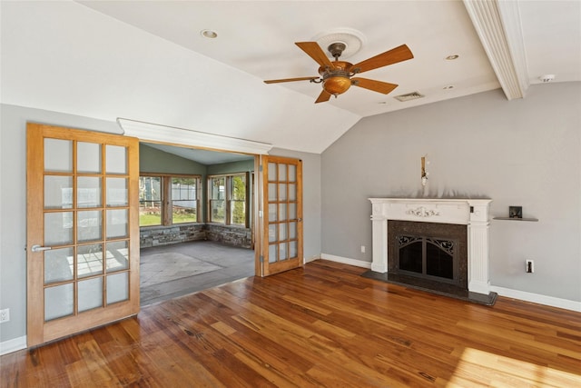 unfurnished living room featuring visible vents, vaulted ceiling, and wood finished floors
