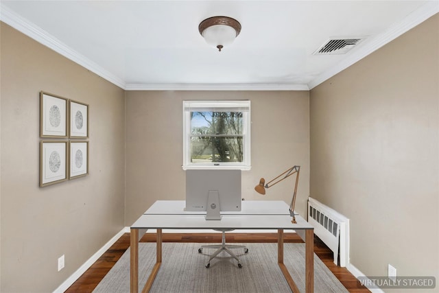 office with radiator heating unit, baseboards, dark wood finished floors, and visible vents