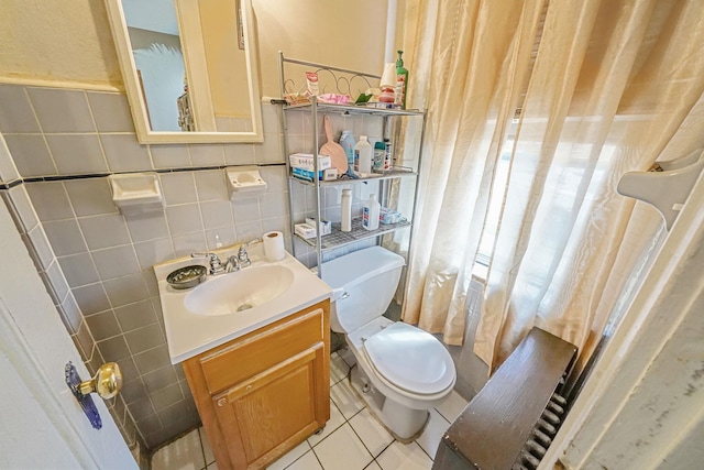 3205 Lafayette Ave, Bronx, NY 10465 - bathroom featuring vanity, tile patterned floors, toilet, decorative backsplash, and tile walls