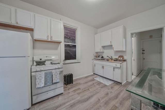 3205 Lafayette Ave, Bronx, NY 10465 - kitchen featuring light wood-style flooring, white cabinetry, baseboards, and white appliances