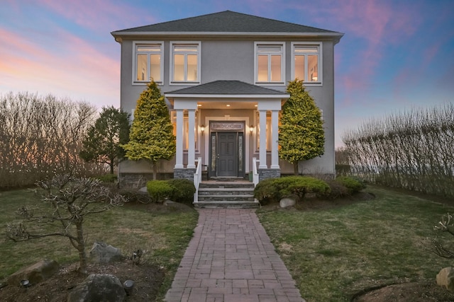 54985 Cr48, Southold, NY 11971 - traditional-style home featuring a front yard and stucco siding