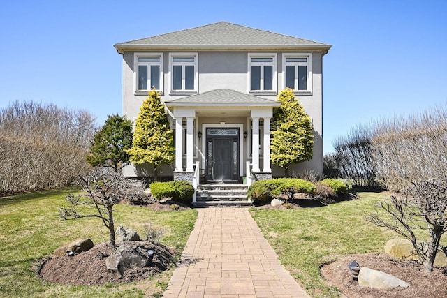 54985 Cr48, Southold, NY 11971 - view of front facade featuring a front yard, stucco siding, and a shingled roof