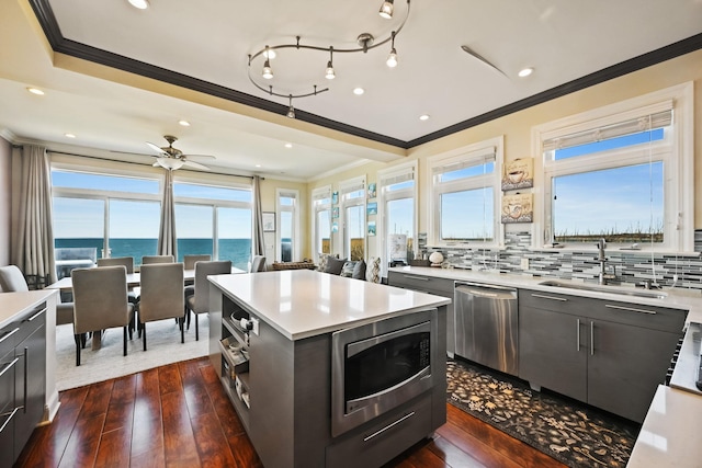 54985 Cr48, Southold, NY 11971 - kitchen with light countertops, crown molding, a sink, and stainless steel appliances