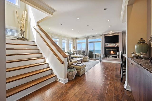54985 Cr48, Southold, NY 11971 - stairway with crown molding, recessed lighting, hardwood / wood-style floors, and a fireplace