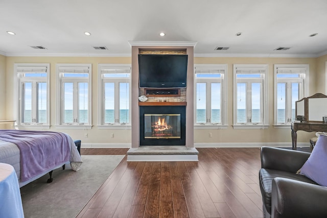 54985 Cr48, Southold, NY 11971 - bedroom featuring a fireplace, visible vents, and dark wood finished floors
