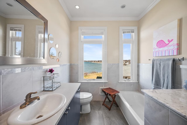 54985 Cr48, Southold, NY 11971 - full bath featuring a bath, vanity, a water view, toilet, and tile walls
