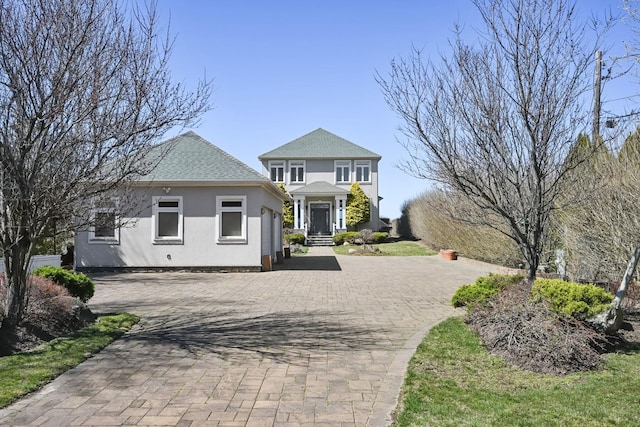 54985 Cr48, Southold, NY 11971 - view of front of property with a shingled roof, stucco siding, and decorative driveway