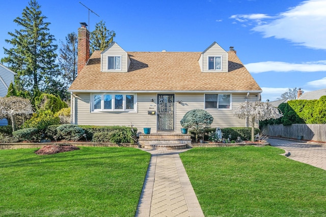 11 Northcote Rd, Westbury, NY 11590 - cape cod-style house with a front yard, roof with shingles, fence, and a chimney