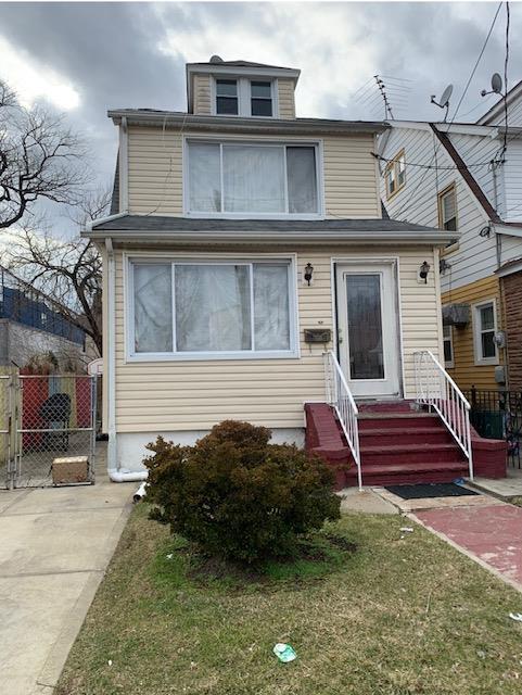 116-42 196th St, Saint Albans, NY 11412 - american foursquare style home featuring entry steps and fence