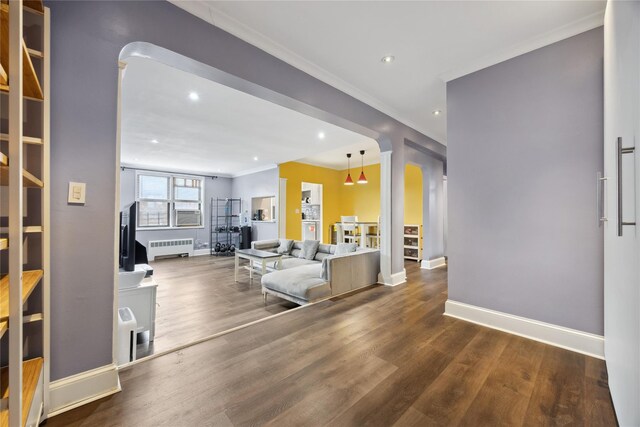 7211 110th St Unit 5G, Forest Hills, NY 11375 - living room with radiator heating unit, wood finished floors, baseboards, ornamental molding, and recessed lighting