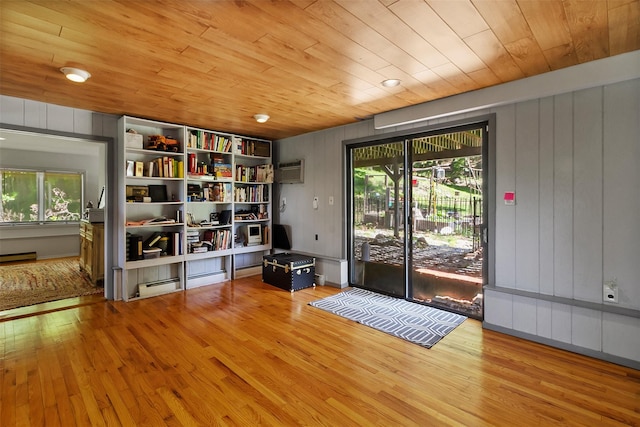 2358 Maple Ave, Cortlandt Manor, NY 10567 - doorway to outside with wooden ceiling, wood finished floors, plenty of natural light, a wall mounted air conditioner, and wood walls