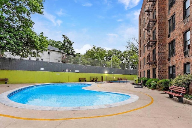 35-20 Leverich St Unit A 504, Jackson Heights, NY 11372 - view of swimming pool with fence and a fenced in pool