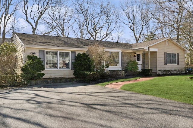 46 Neptune Ave, Hampton Bays, NY 11946 - ranch-style home with a front lawn