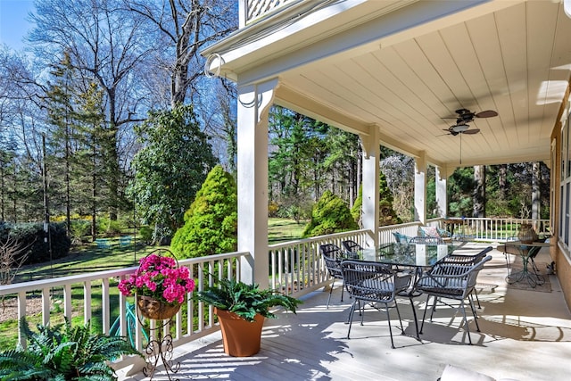 3 Druid Hill Rd, Port Jefferson, NY 11777 - deck featuring a ceiling fan, view of scattered trees, and outdoor dining area