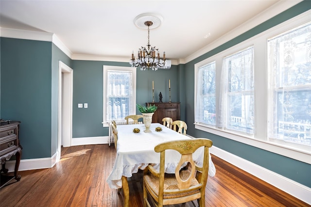 3 Druid Hill Rd, Port Jefferson, NY 11777 - dining area featuring a chandelier, crown molding, baseboards, and dark wood finished floors