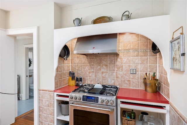 3 Druid Hill Rd, Port Jefferson, NY 11777 - kitchen featuring gas stove, ventilation hood, wood finished floors, and tasteful backsplash