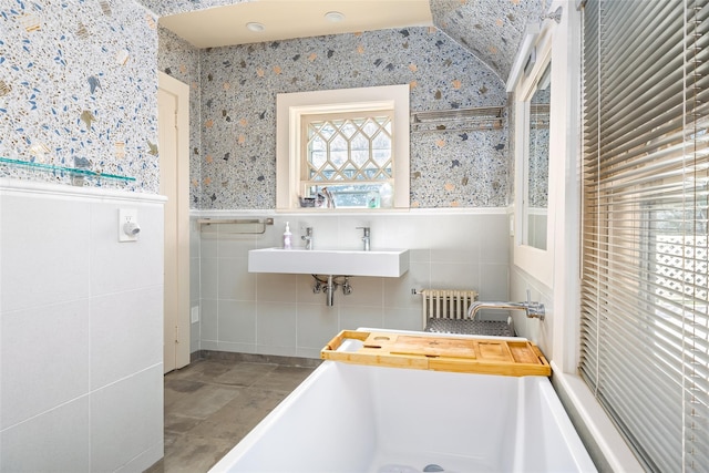3 Druid Hill Rd, Port Jefferson, NY 11777 - bathroom featuring radiator, wallpapered walls, a wainscoted wall, and a sink