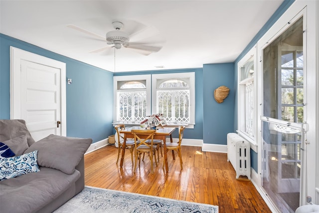 3 Druid Hill Rd, Port Jefferson, NY 11777 - dining area featuring baseboards, ceiling fan, wood finished floors, and plenty of natural light