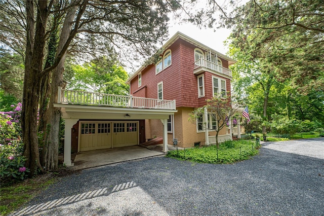 3 Druid Hill Rd, Port Jefferson, NY 11777 - view of front of home featuring driveway, a balcony, and a garage