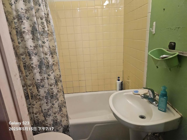 57-12 164th St, Flushing, NY 11365 - bathroom with a sink, shower / tub combo with curtain, and toilet