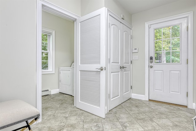 interior space featuring washer / dryer, a baseboard radiator, and baseboards