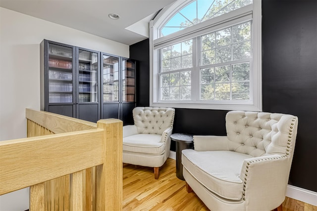 sitting room with light wood-type flooring