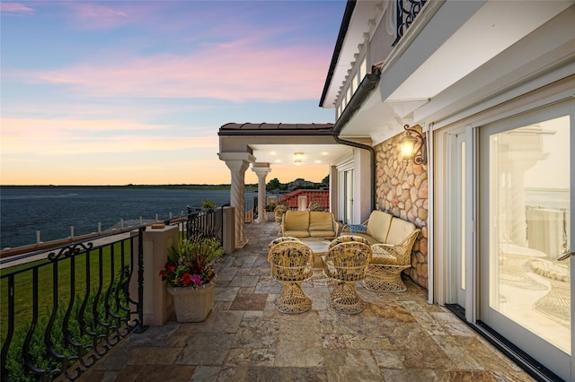 1101 Harbor Rd, Hewlett, NY 11557 - balcony at dusk with a water view, a patio area, and outdoor lounge area
