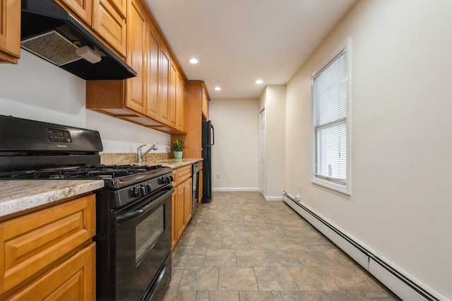 3 September Walk, Long Beach, NY 11561 - kitchen with black appliances, a baseboard heating unit, under cabinet range hood, baseboards, and stone finish flooring