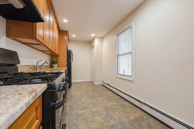 3 September Walk, Long Beach, NY 11561 - kitchen with a baseboard heating unit, black appliances, under cabinet range hood, baseboards, and a sink