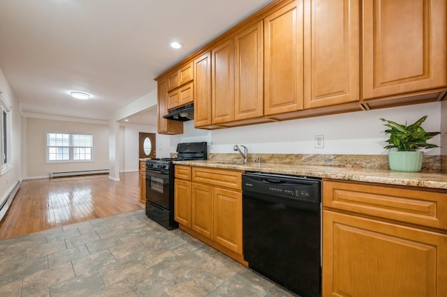 3 September Walk, Long Beach, NY 11561 - kitchen featuring black appliances, a baseboard heating unit, under cabinet range hood, a sink, and light stone counters