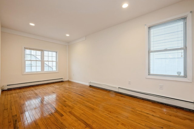 3 September Walk, Long Beach, NY 11561 - empty room with a baseboard heating unit, hardwood / wood-style flooring, recessed lighting, and baseboards