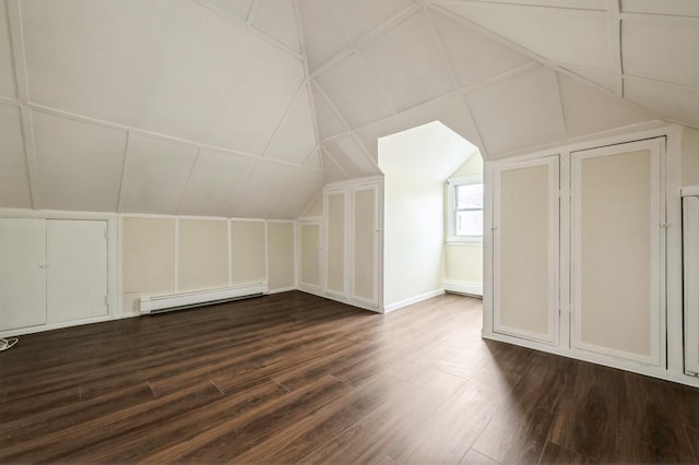 3 September Walk, Long Beach, NY 11561 - additional living space featuring baseboard heating, dark wood-type flooring, vaulted ceiling, and a decorative wall