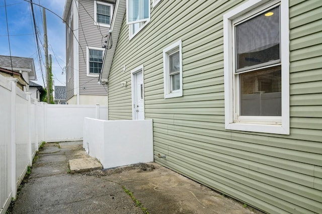 3 September Walk, Long Beach, NY 11561 - view of side of home featuring a patio area and a fenced backyard