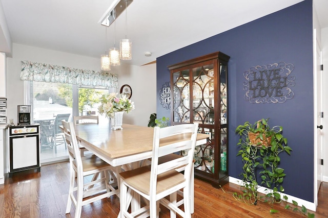 dining room featuring a notable chandelier and wood finished floors
