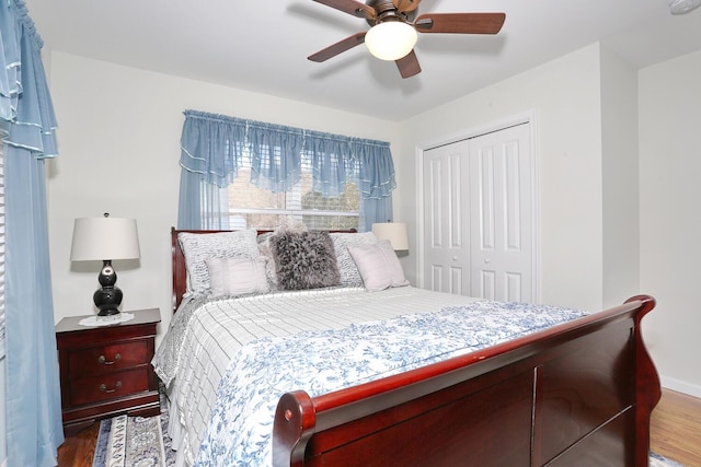 bedroom featuring a closet, a ceiling fan, and wood finished floors