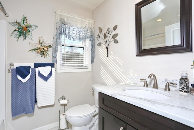 bathroom featuring vanity and toilet