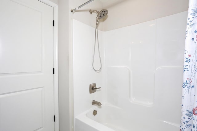 bathroom featuring shower / bath combo with shower curtain