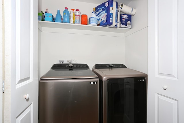 clothes washing area with laundry area and washing machine and clothes dryer