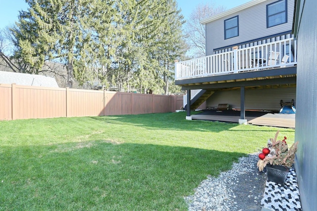 view of yard featuring a deck and fence